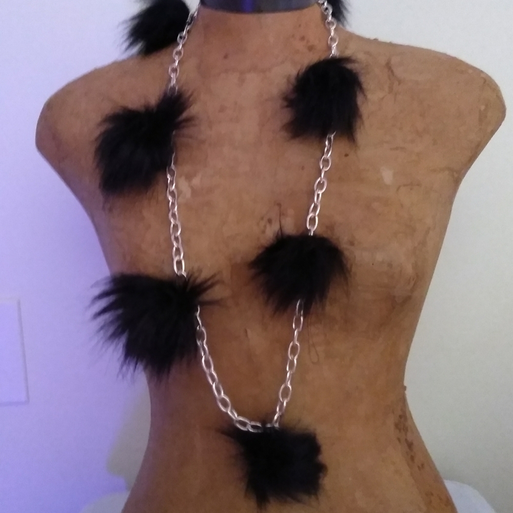 Black faux fur puffs on silver chain
